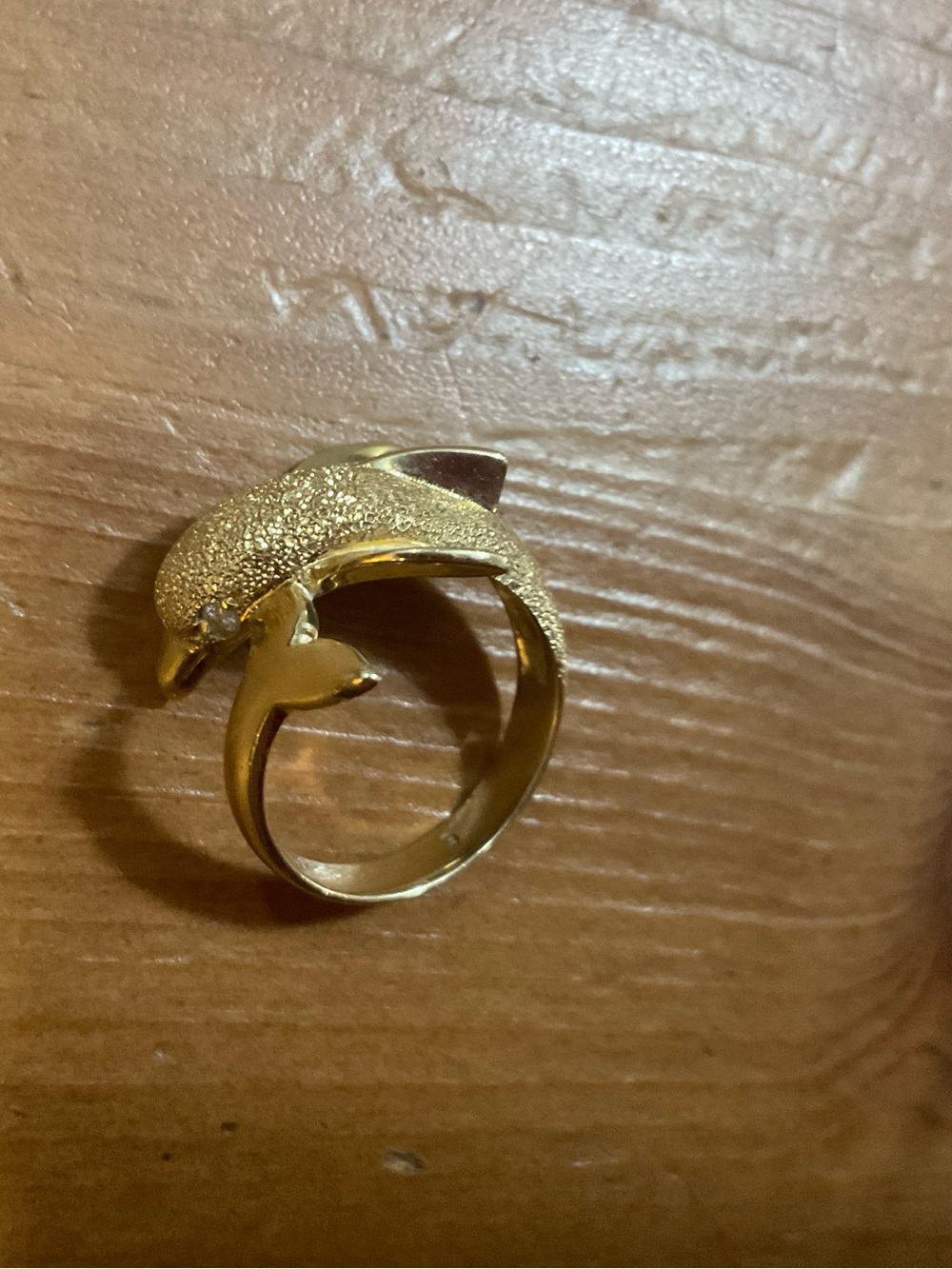 Beverly Hills Gold: 14k. Wrap around dolphin ring with diamond eyes size six (6)
